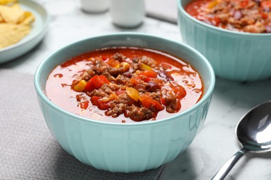Photo of Tasty chili con carne on white table