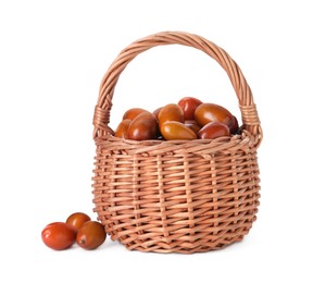 Photo of Wicker basket of ripe red dates on white background