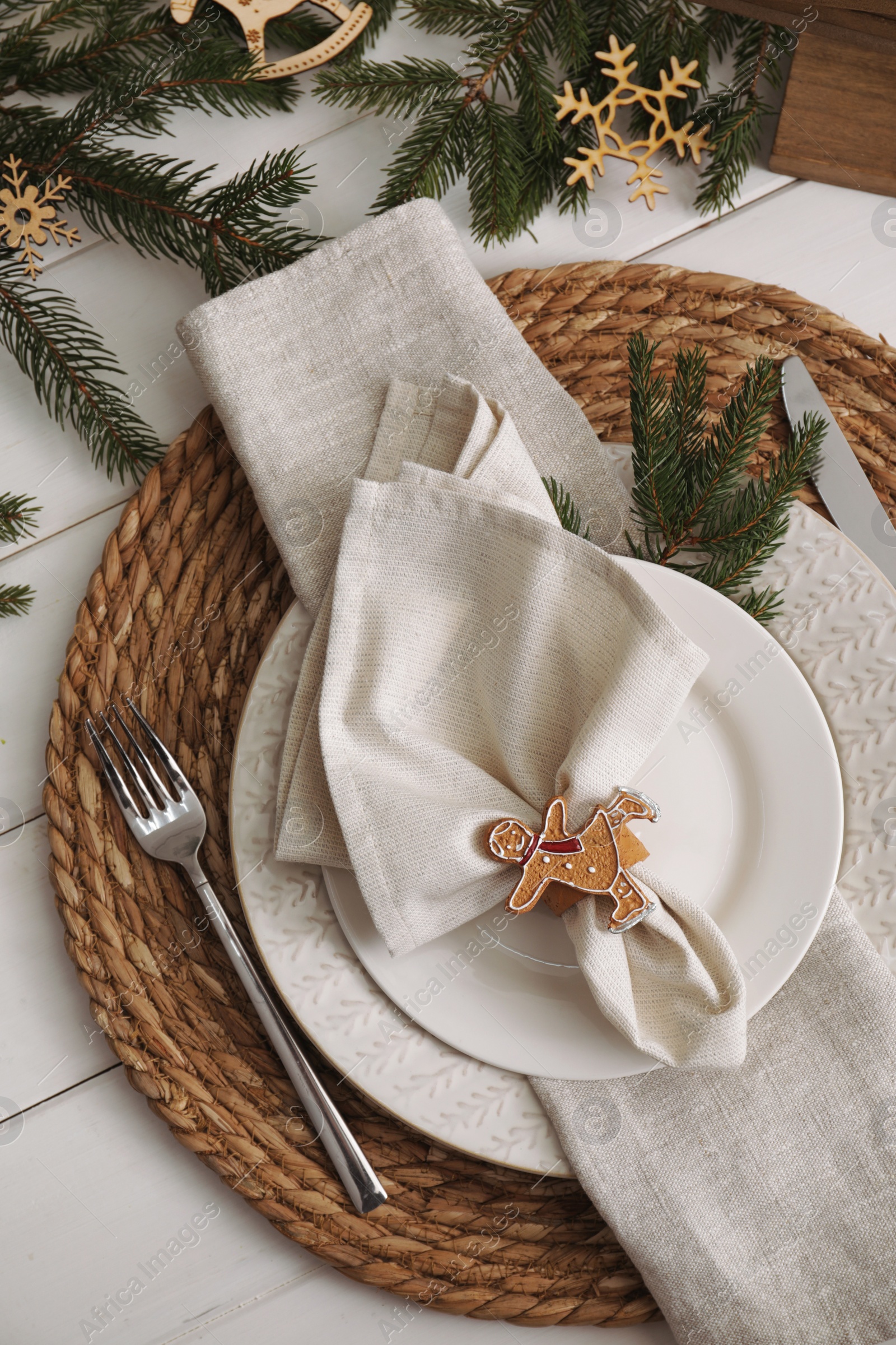 Photo of Beautiful festive place setting with stylish decor for Christmas dinner on white wooden table, flat lay