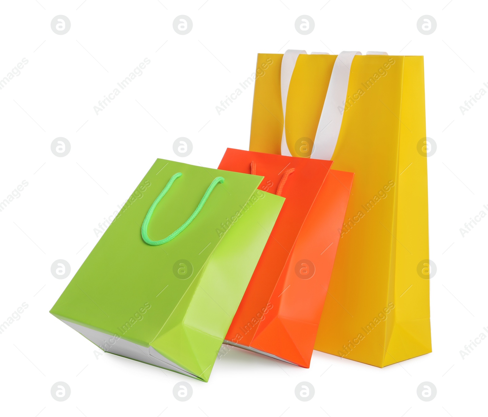 Photo of Colorful paper shopping bags isolated on white