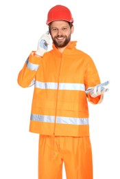 Man in reflective uniform talking on smartphone against white background