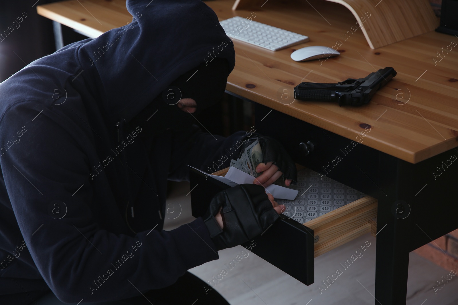 Photo of Dangerous masked criminal stealing money from house