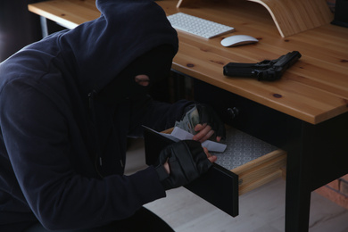 Photo of Dangerous masked criminal stealing money from house