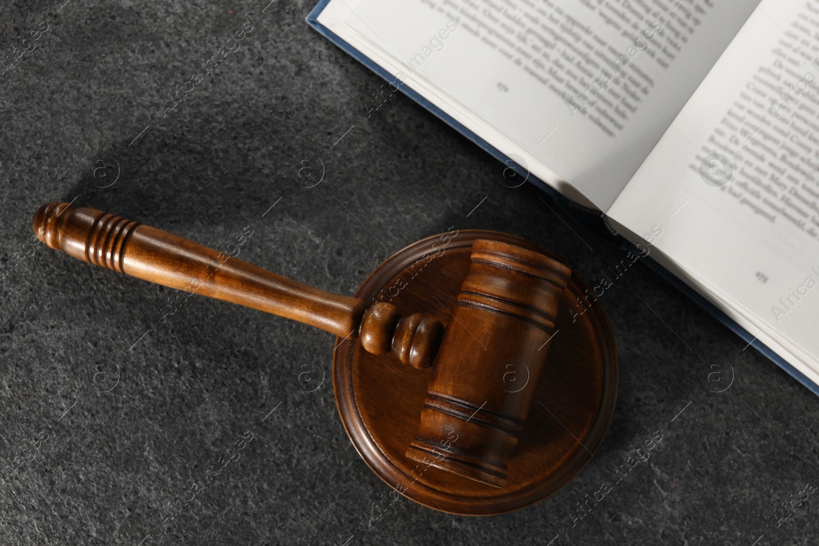 Photo of Law concept. Gavel and book on grey textured table, top view