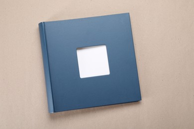Photo of One blue photo album on color background, top view