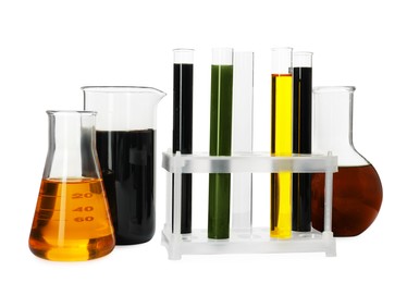 Photo of Beaker, test tubes and flasks with different types of oil isolated on white