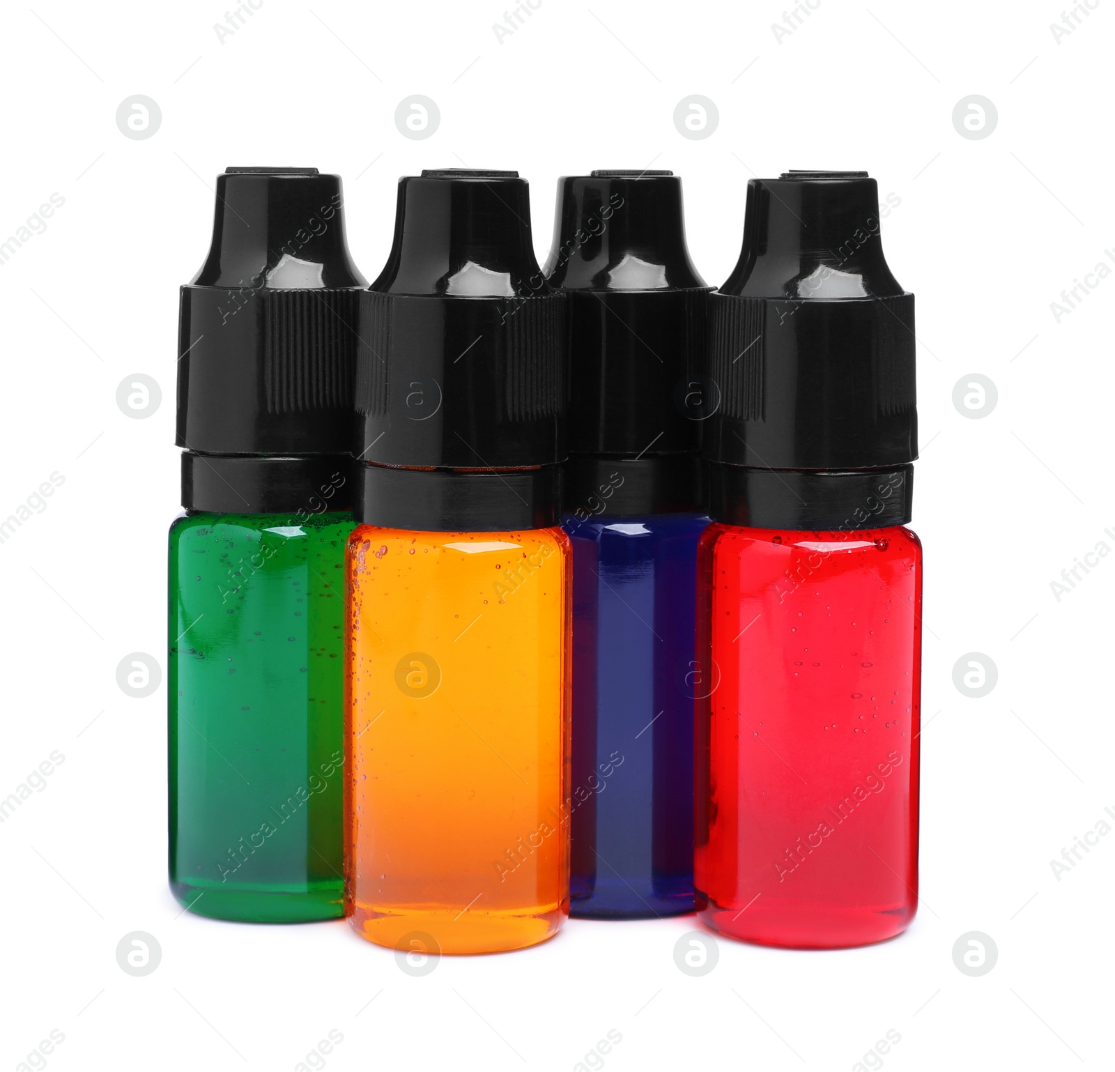 Photo of Bottles with different food coloring on white background