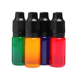 Photo of Bottles with different food coloring on white background