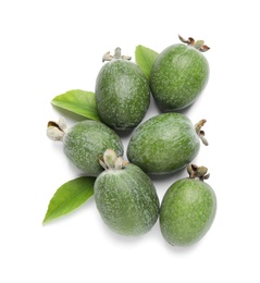 Photo of Pile of feijoas and leaves on white background, top view