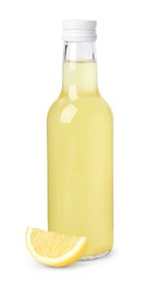 Delicious kombucha in glass bottle and lemon isolated on white