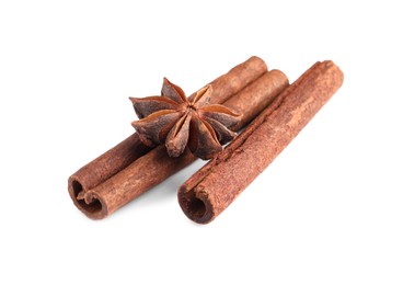 Photo of Cinnamon sticks and anise star isolated on white