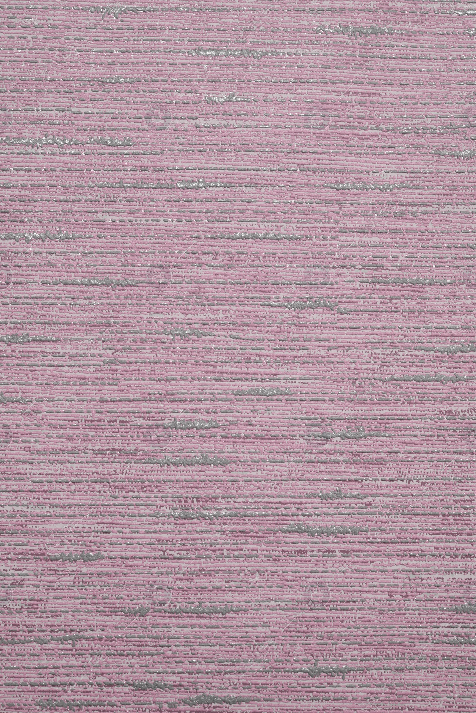 Image of Pink wallpaper sheet as background, top view