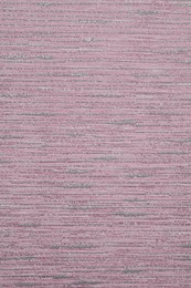 Image of Pink wallpaper sheet as background, top view