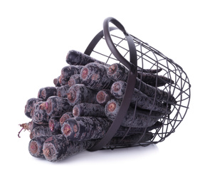 Photo of Raw black carrots in metal basket isolated on white