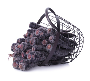 Raw black carrots in metal basket isolated on white