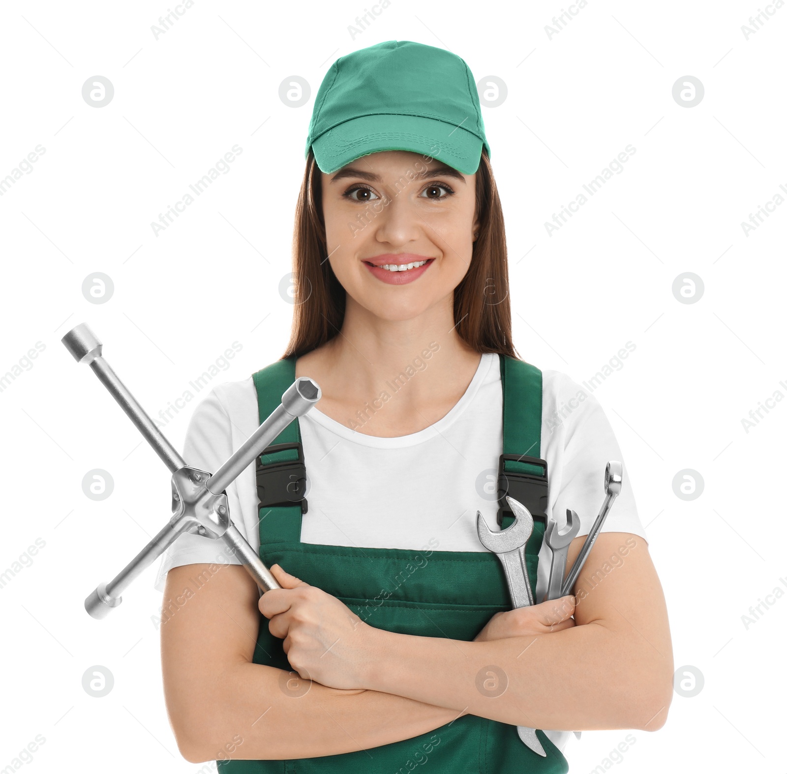 Photo of Portrait of professional auto mechanic with wrenches on white background