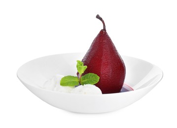 Photo of Tasty red wine poached pear with mint 'and ice cream isolated on white