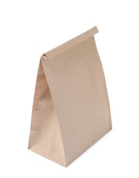 Photo of Closed kraft paper bag isolated on white