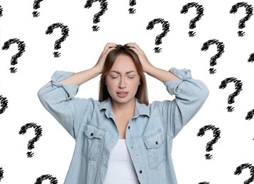 Image of Amnesia. Confused young woman and question marks on white background