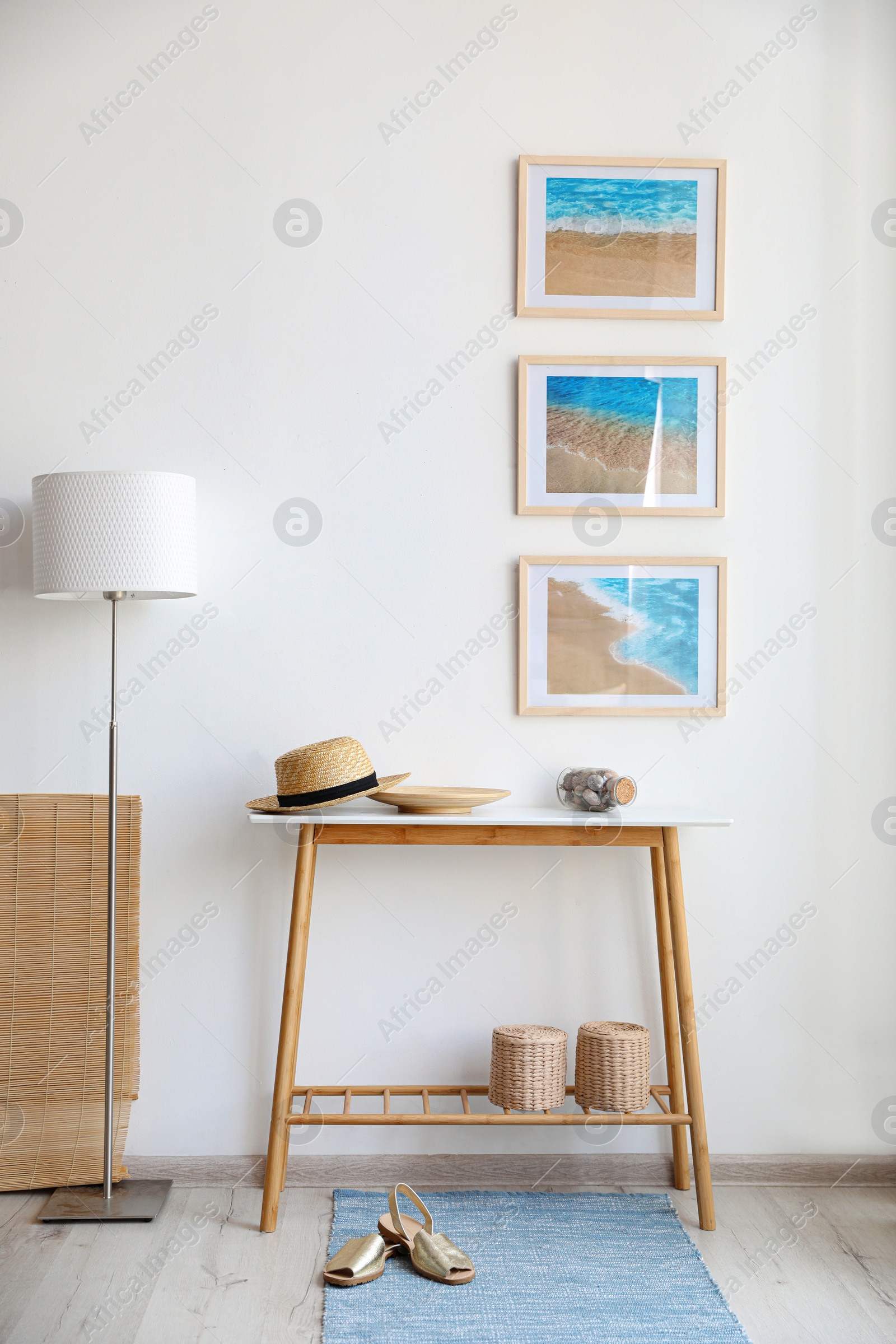 Photo of Stylish room interior with trendy furniture and pictures on wall