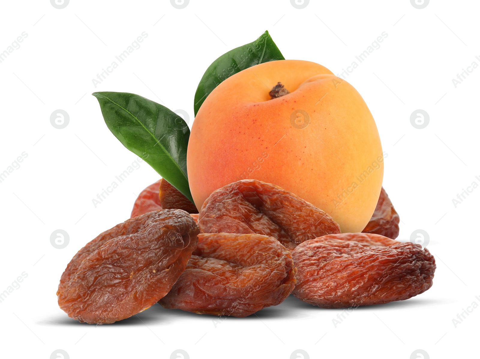 Image of Tasty dried apricots and fresh one with green leaves on white background