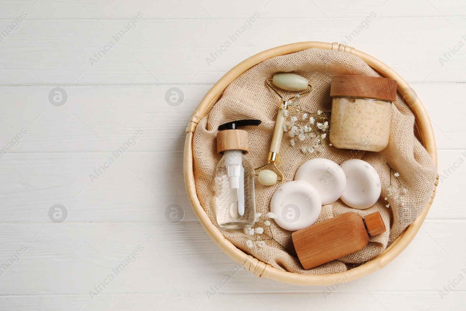 Photo of Spa gift set with personal products on white wooden table, top view. Space for text