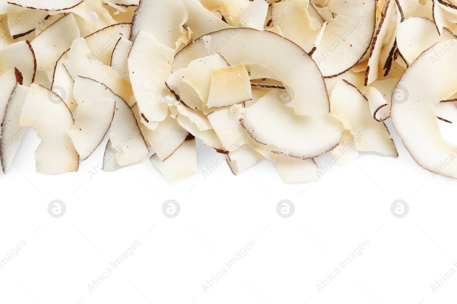 Photo of Pile of coconut chips isolated on white, top view