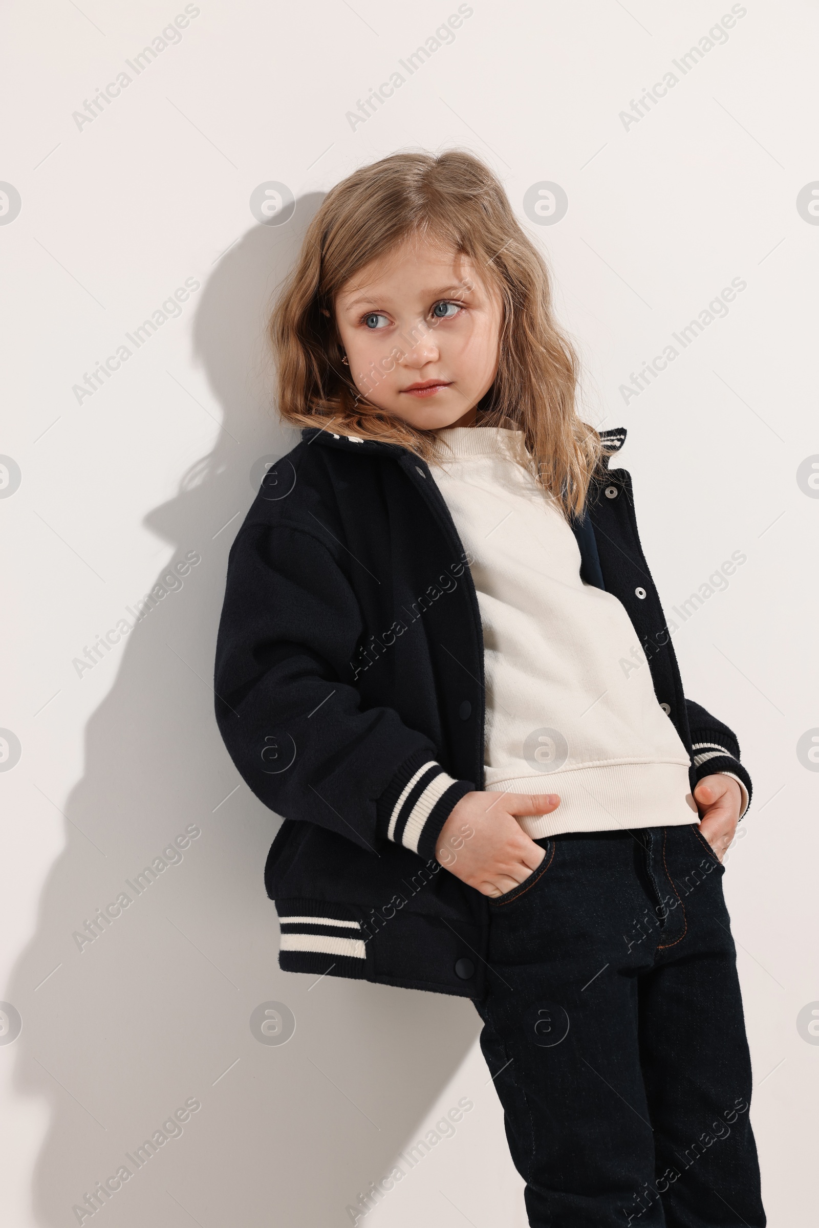 Photo of Fashion concept. Stylish girl posing on white background