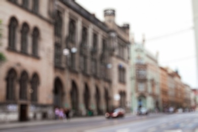 Photo of Blurred view of city street with beautiful building
