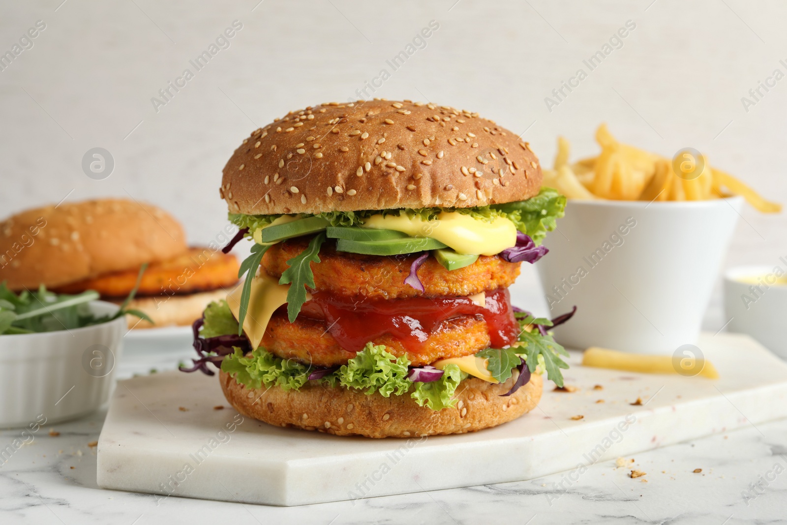 Photo of Vegan burger with carrot patties served on table