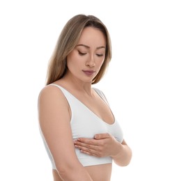 Mammology. Young woman doing breast self-examination on white background