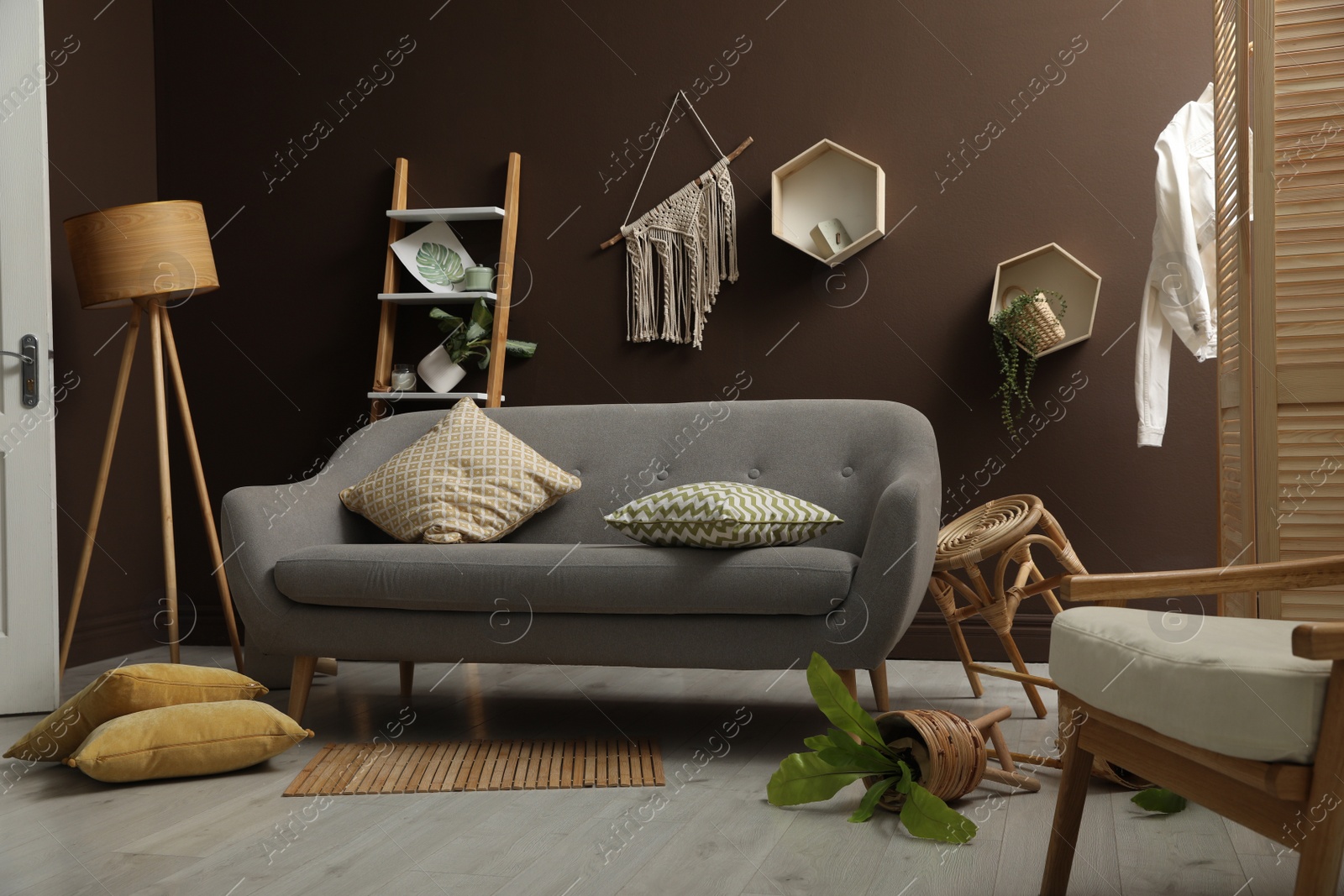 Photo of View on messy living room interior after earthquake