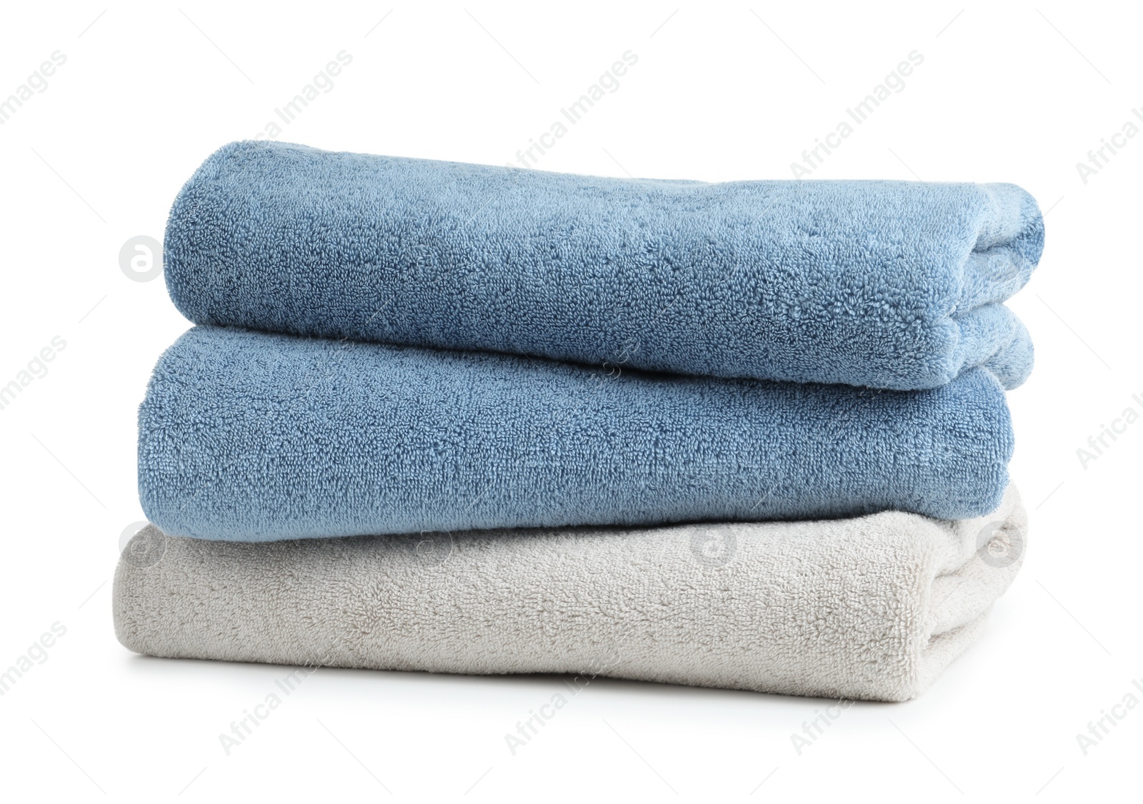 Photo of Stack of clean soft towels on white background