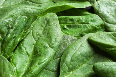 Photo of Fresh green healthy spinach as background, closeup view