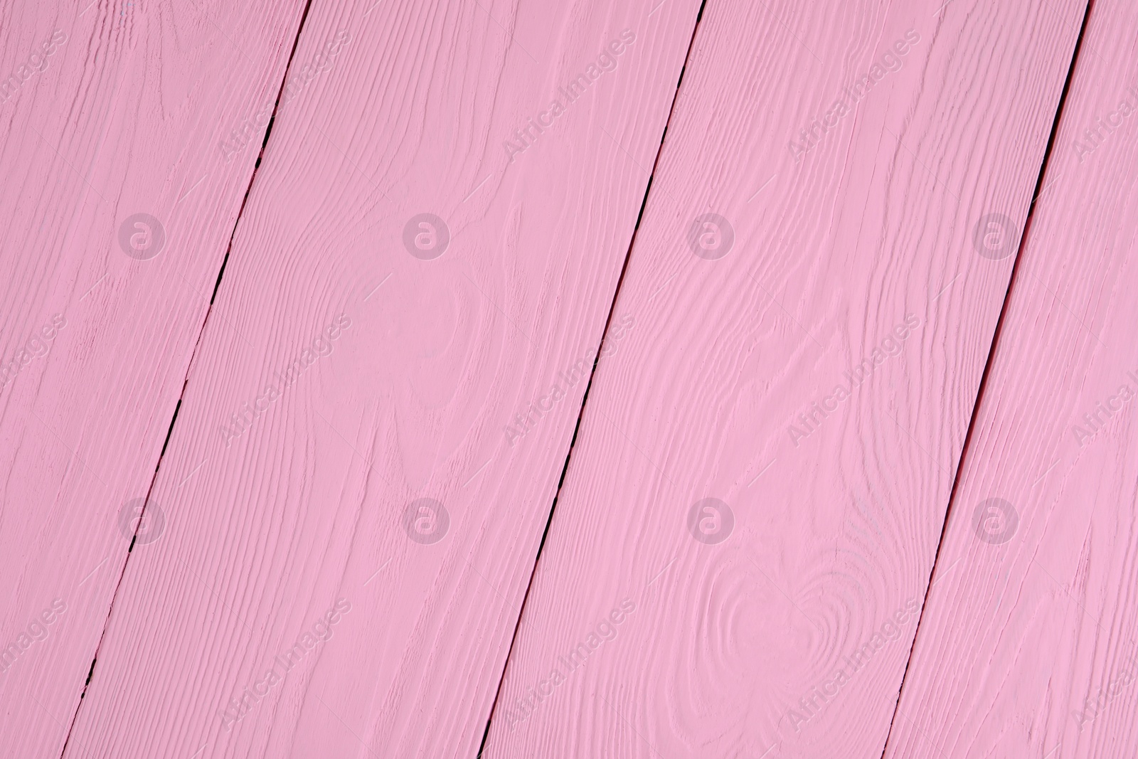 Photo of Texture of pink wooden surface as background, closeup