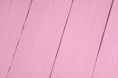 Photo of Texture of pink wooden surface as background, closeup