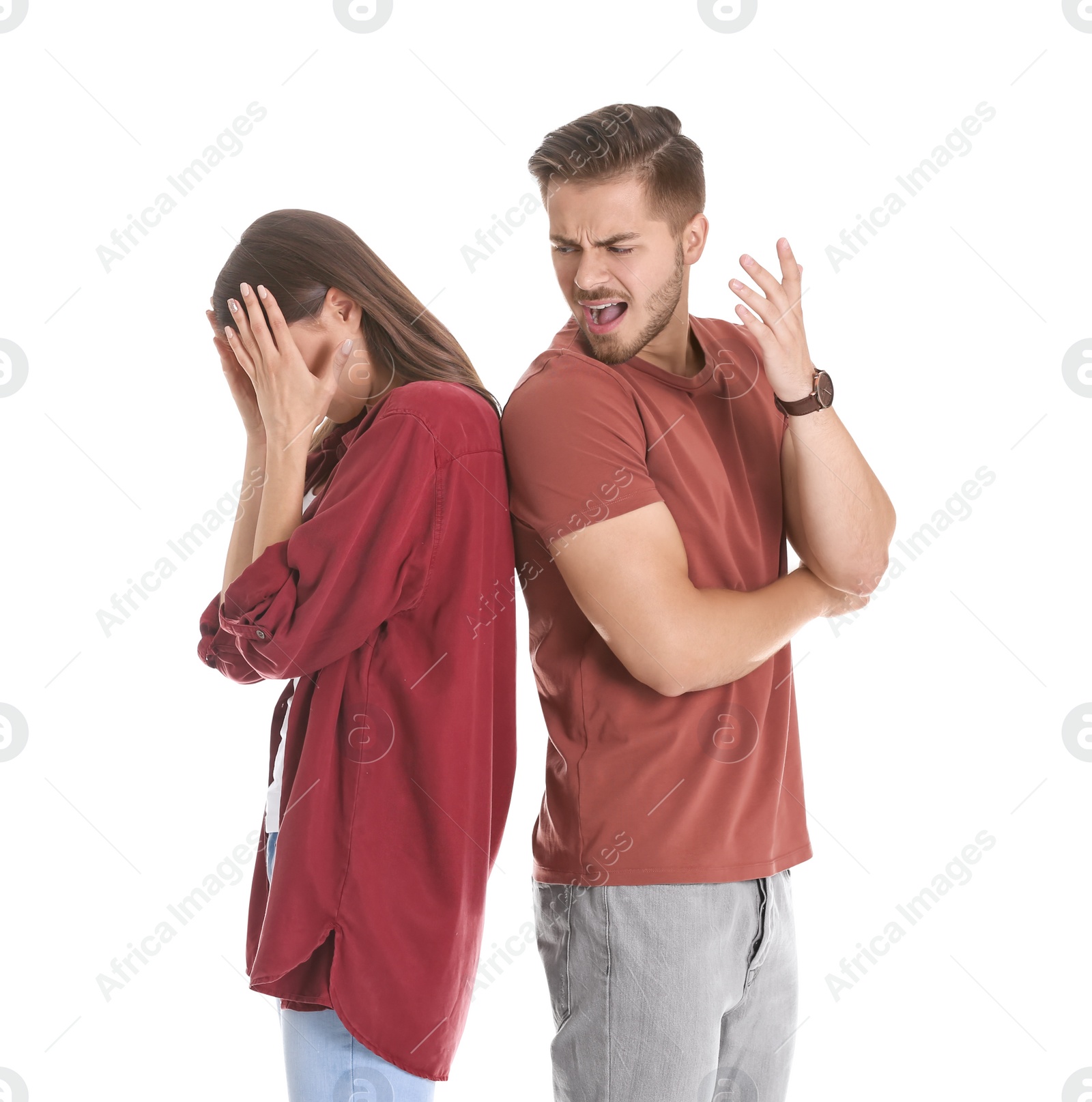 Photo of Young couple having argument on white background. Relationship problems