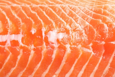 Photo of Raw salmon fillet as background, closeup