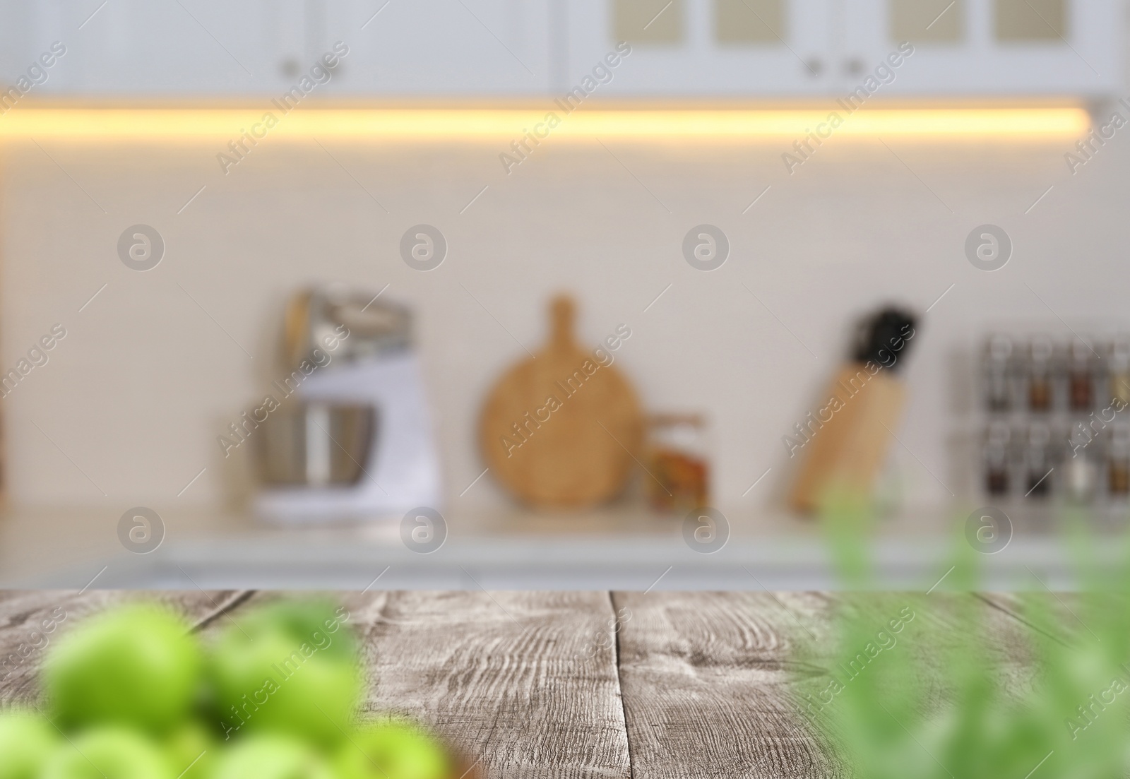 Image of Wooden table in light kitchen. Space for design