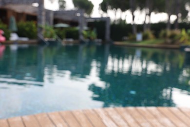 Blurred view of outdoor swimming pool at luxury resort