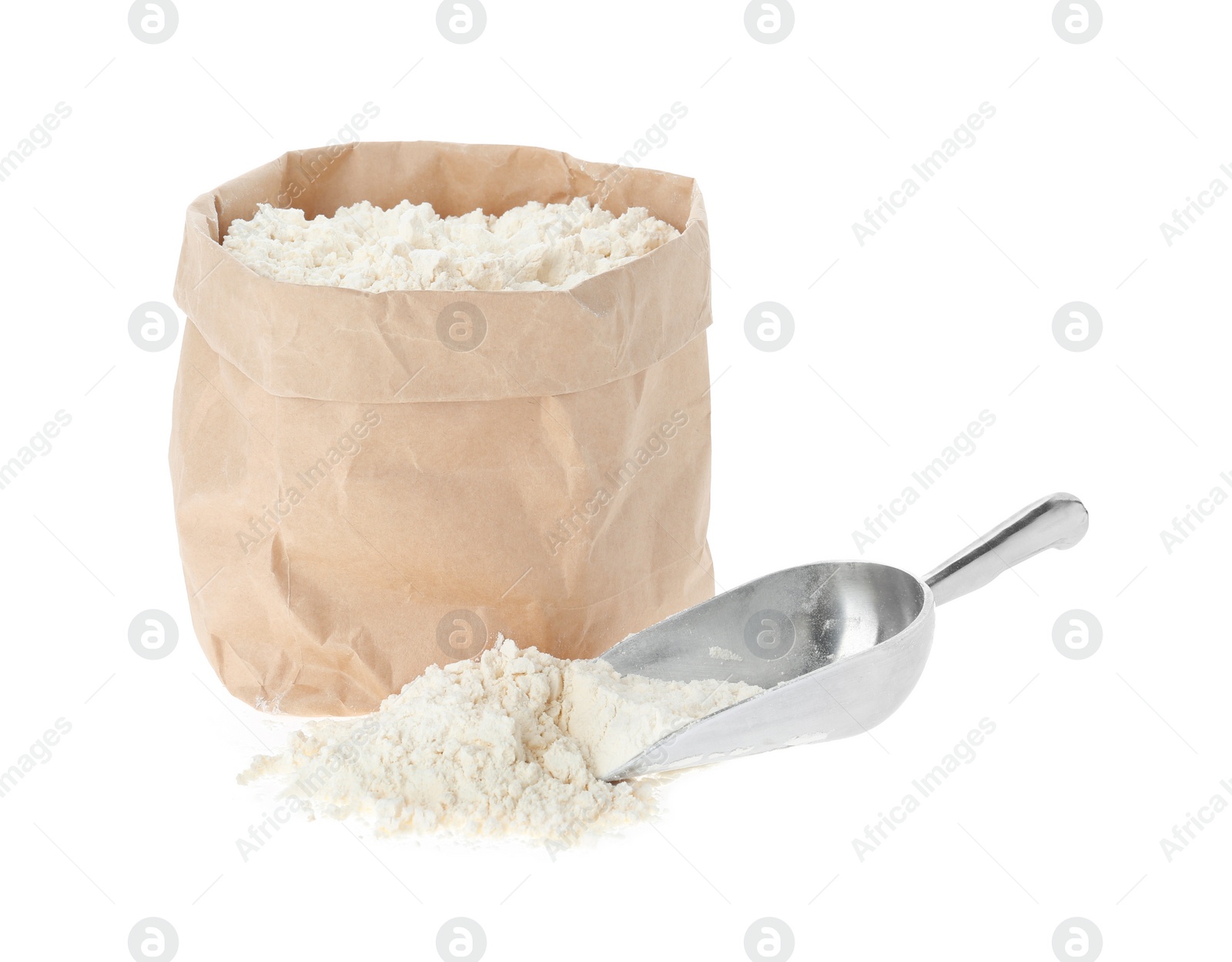 Photo of Paper bag and scoop with flour isolated on white