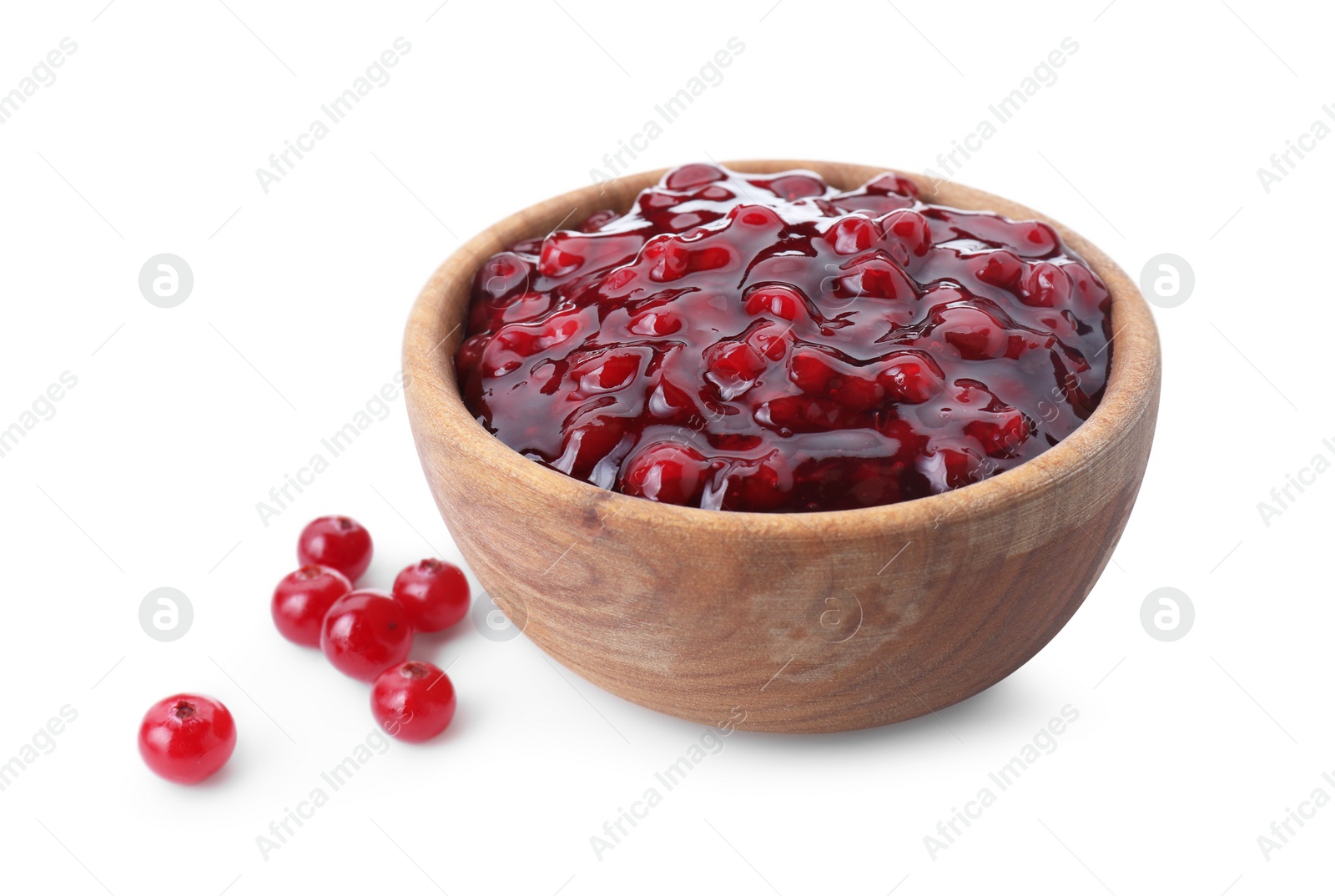 Photo of Tasty cranberry sauce in bowl and fresh berries isolated on white