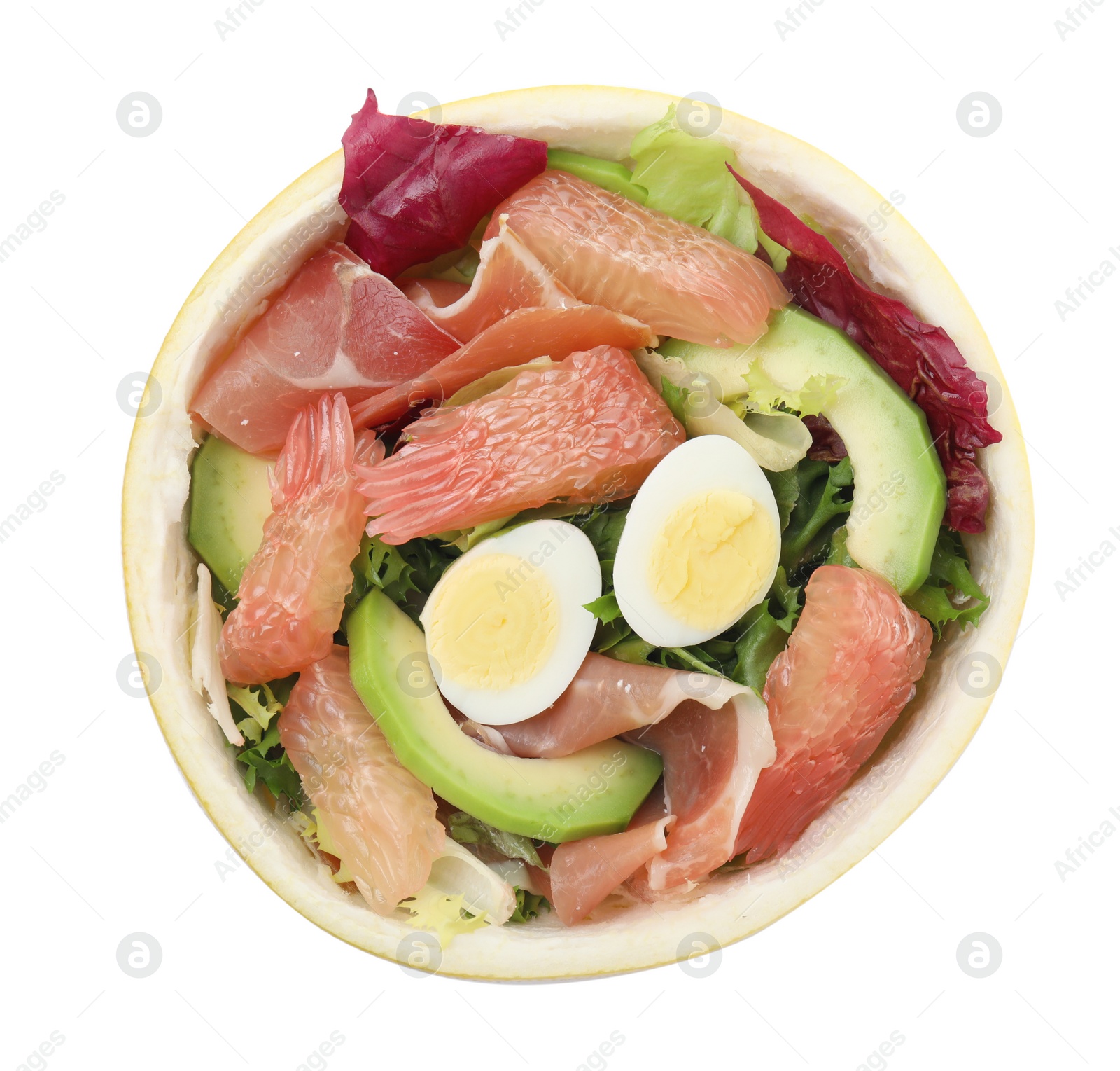 Photo of Delicious pomelo salad with prosciutto in half of fruit isolated on white, top view