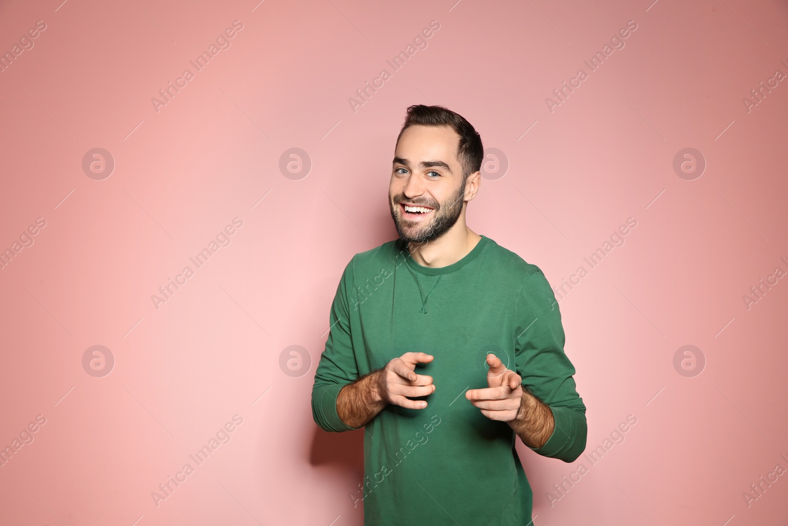 Photo of Portrait of handsome young man on color background