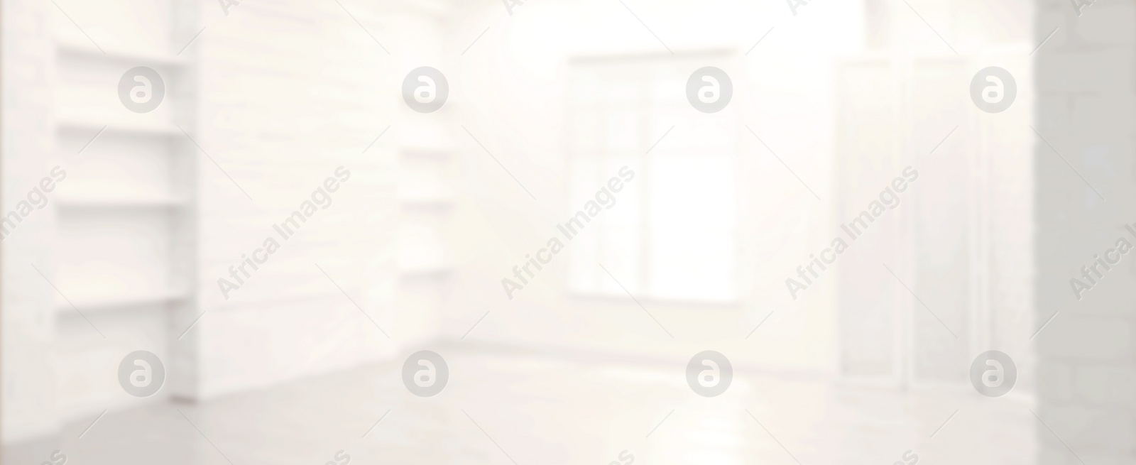 Image of Empty room with white walls and window, blurred view. Banner design