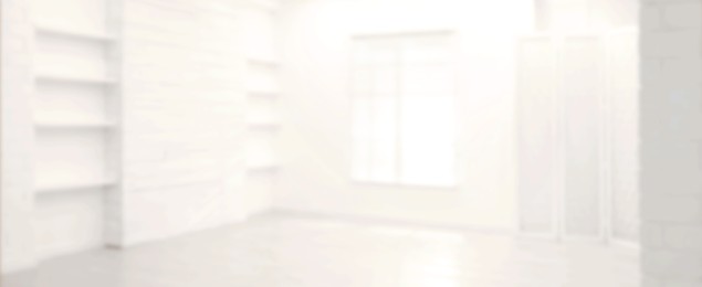 Image of Empty room with white walls and window, blurred view. Banner design