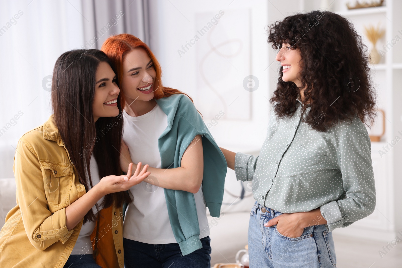 Photo of Happy young friends spending time together at home