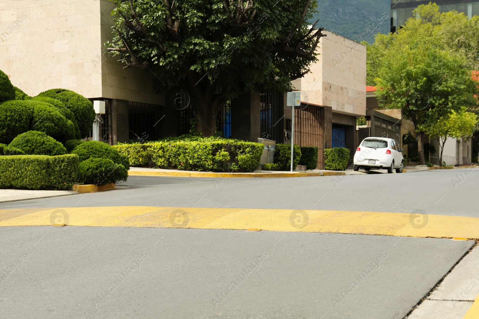 Photo of Speed bump on asphalt road in city