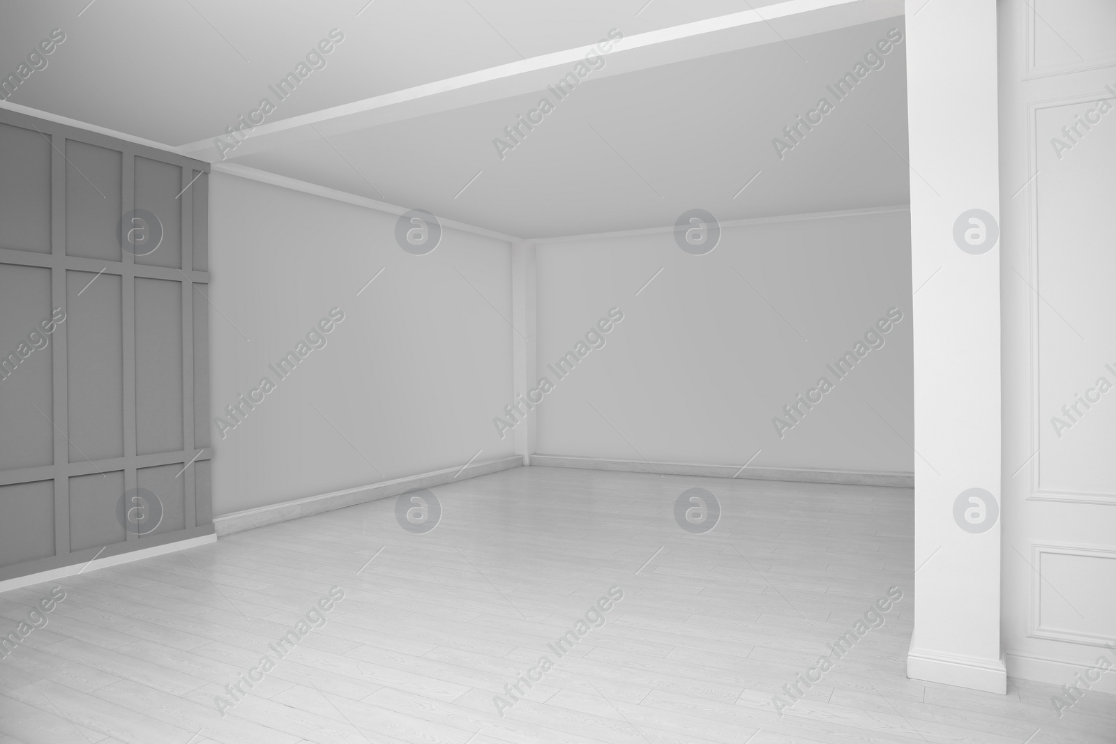 Photo of Empty room with grey wall and laminated floor