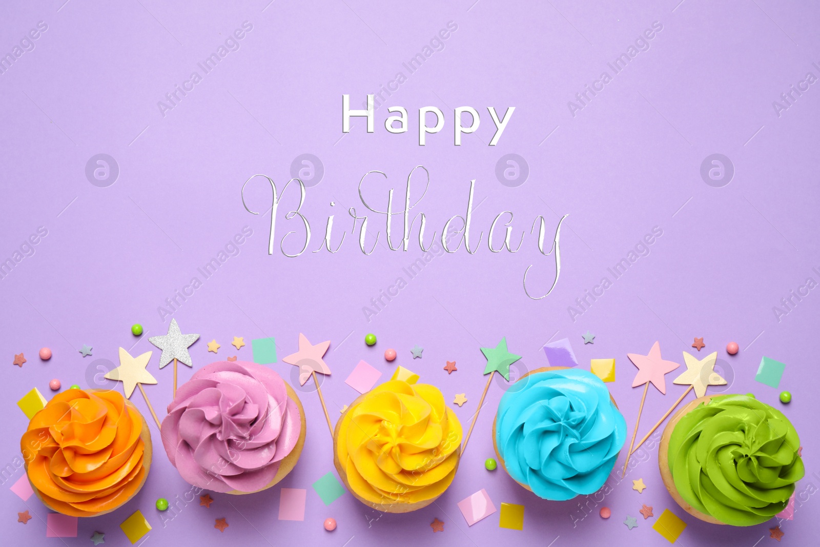 Image of Delicious cupcakes and text Happy Birthday on lilac background, flat lay